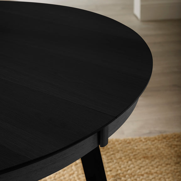 Round black table with a blurred background