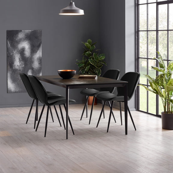 Dining area with a dark wooden table and black chairs in a modern room.