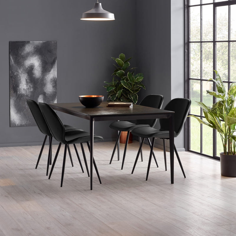 Dining area with a dark wooden table and black chairs in a modern room.
