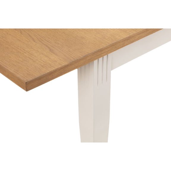 Wooden table corner with white base on a white background