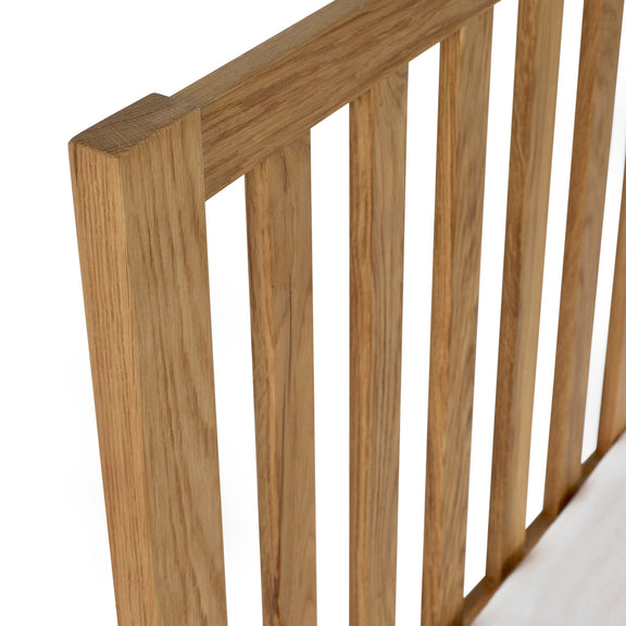Wooden crib railing on a white background