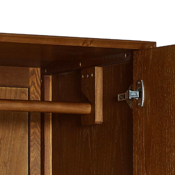 Wooden cabinet with open door showing a hinge and interior.