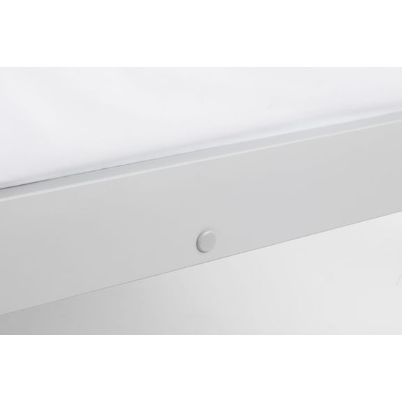 Close-up of a white ceiling light fixture with a white wall background