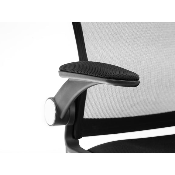 Close-up of a black office chair with mesh backrest on a white background