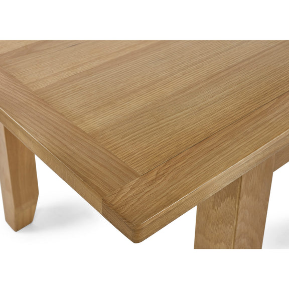 Wooden table with a light brown finish on a white background