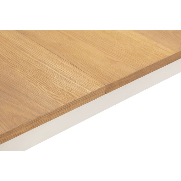 Wooden table top with a white base on a white background