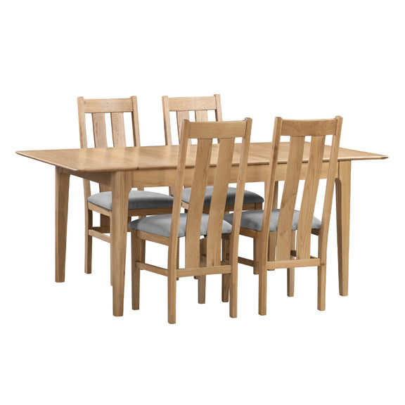 Wooden dining table with four matching chairs on a white background