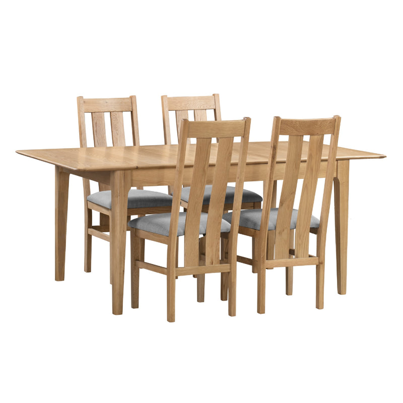 Wooden dining table with four matching chairs on a white background