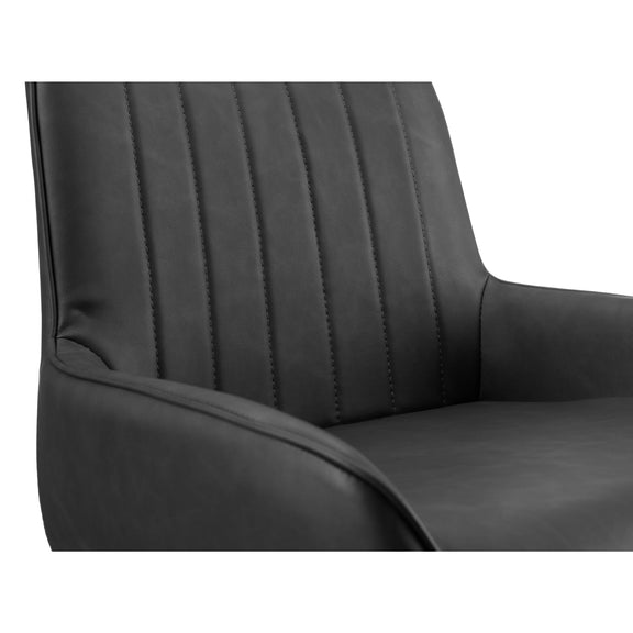 Close-up of a black leather chair with visible stitching on a white background