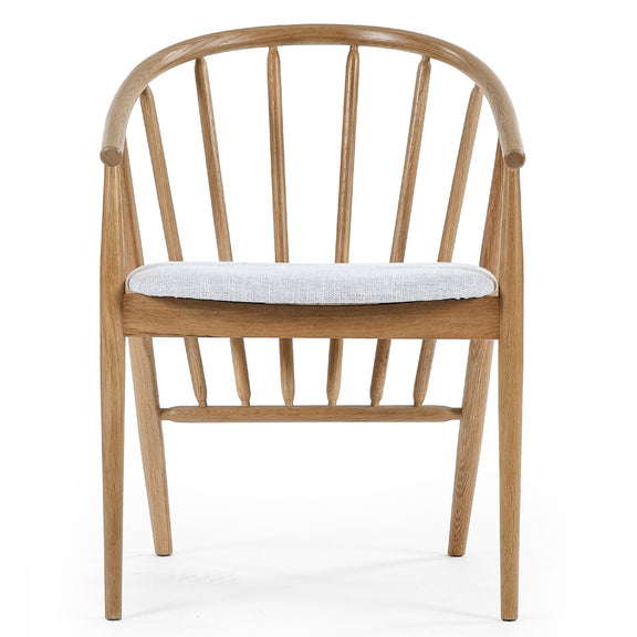 Wooden chair with a white cushion on a white background