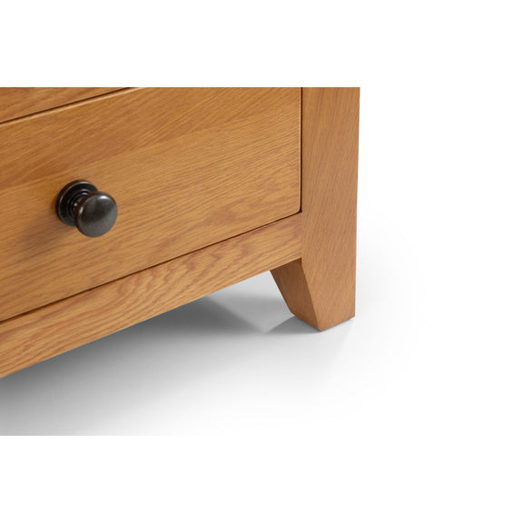 Wooden drawer with a black handle on a white background