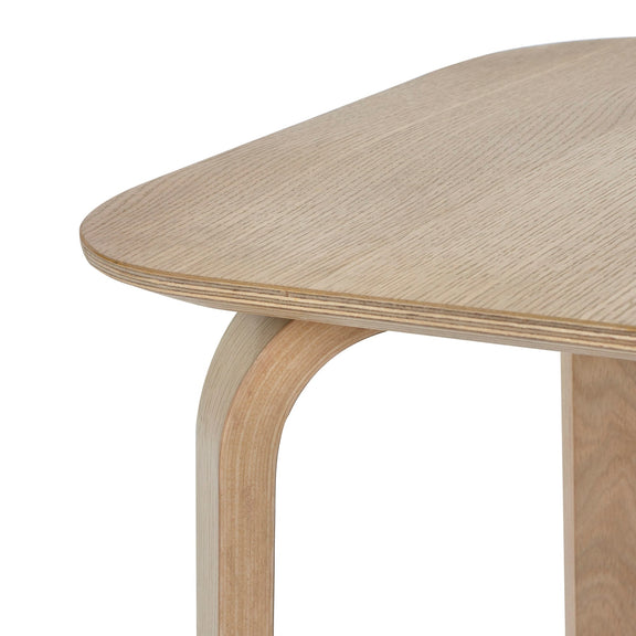 Close-up of a wooden table with a white background