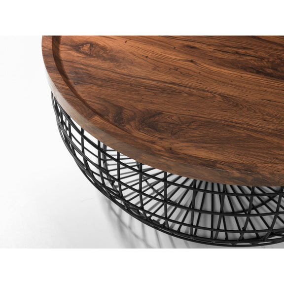 Wooden table with a black wire base on a white background