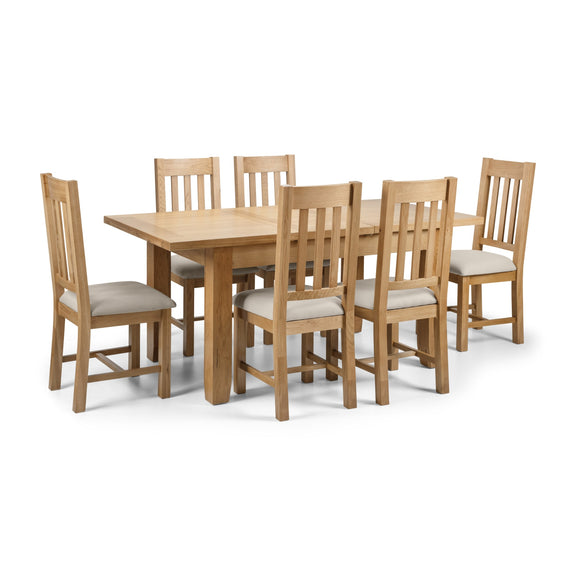 Wooden dining table with six matching chairs on a white background