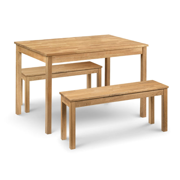 Wooden dining table with two benches on a white background