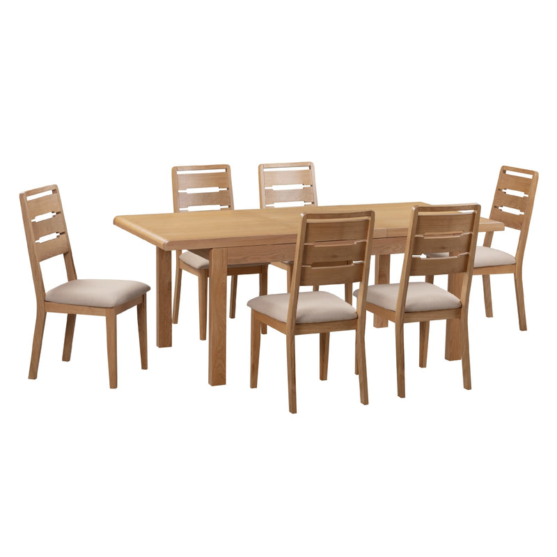 Wooden dining table with six matching chairs on a white background
