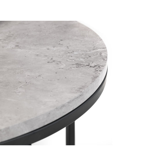 Round table with a gray marble-like top and black metal base on a white background