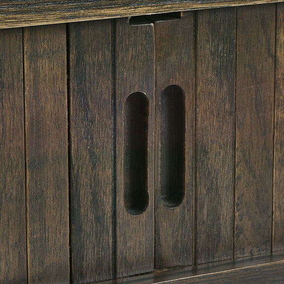 Close-up of a wooden cabinet with a handle