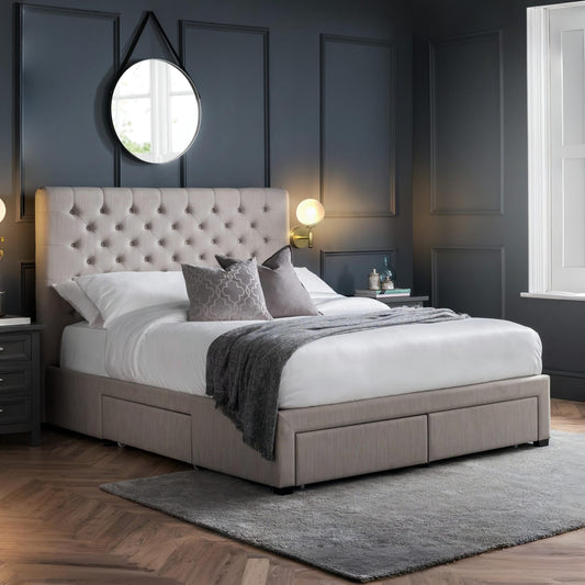 Beige upholstered bed with tufted headboard in a bedroom setting.