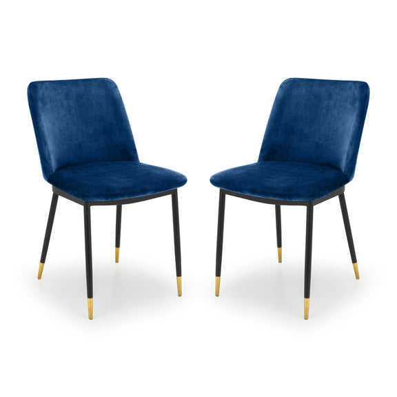 Two blue velvet chairs with black legs on a white background