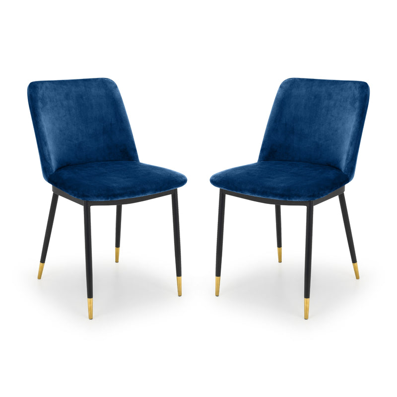 Two blue velvet chairs with black legs on a white background