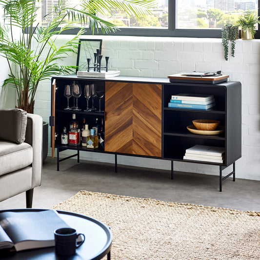 Modern living room with a black and wood sideboard, gray sofa, and coffee table.