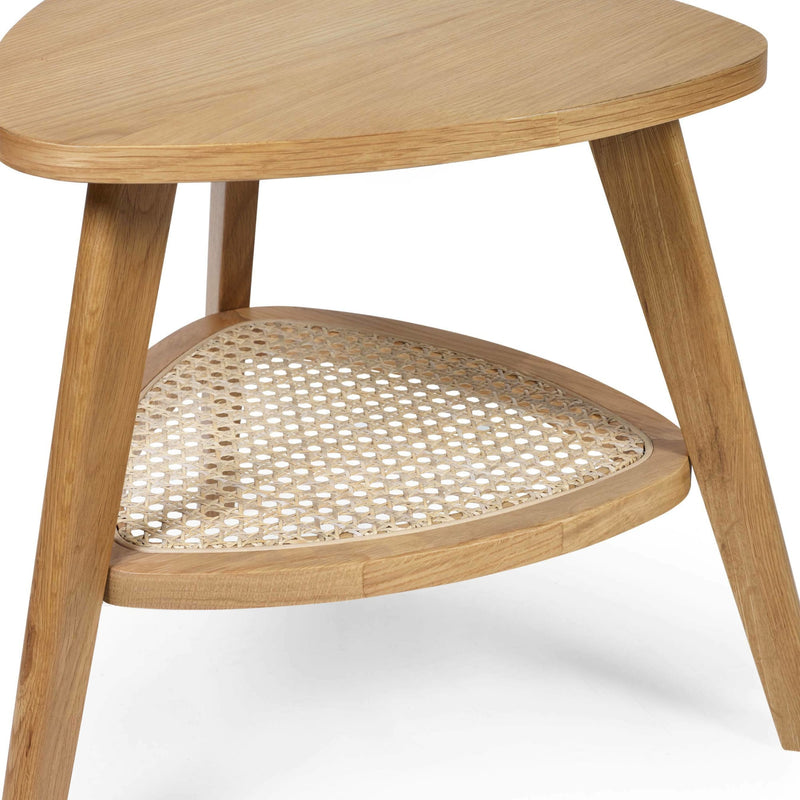 Wooden side table with wicker shelf on a white background
