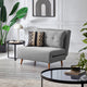 Gray sofa with decorative pillows in a modern living room setting.