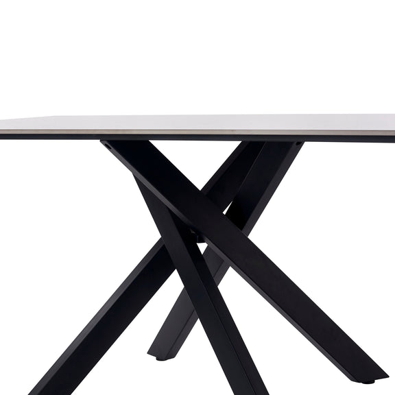 Table with a white top and black metal legs on a white background