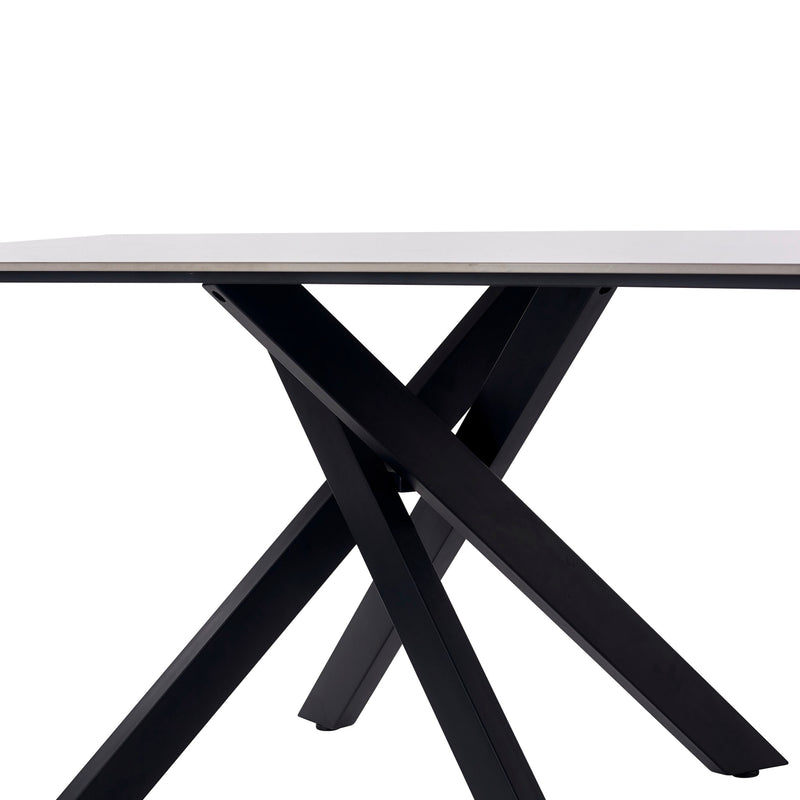 Table with a white top and black metal legs on a white background