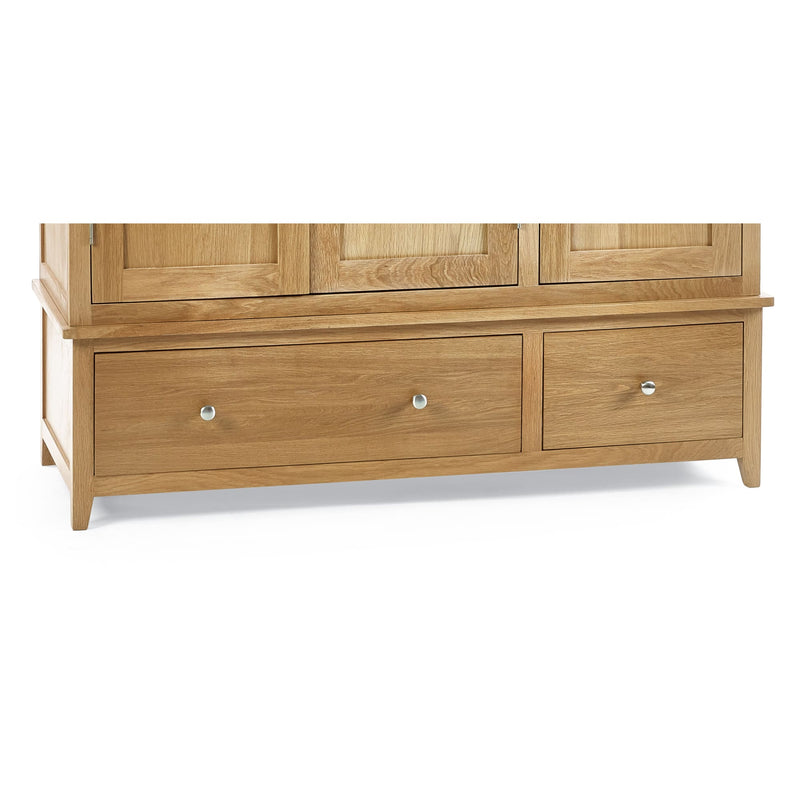Wooden wardrobe with two doors and two drawers on a white background