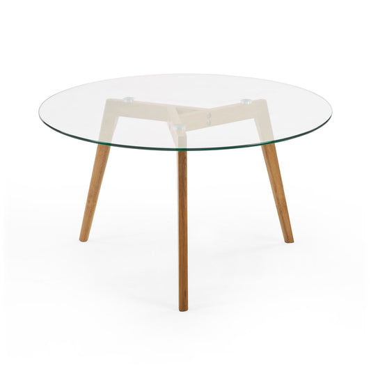 Round glass table with wooden legs on a white background