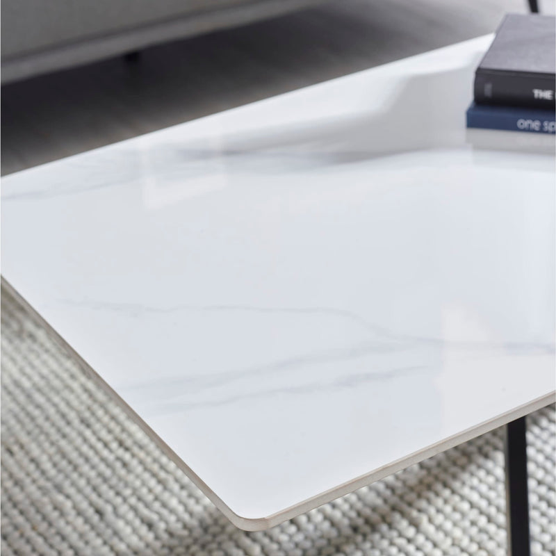 White rectangular object on a textured surface with a blurred background