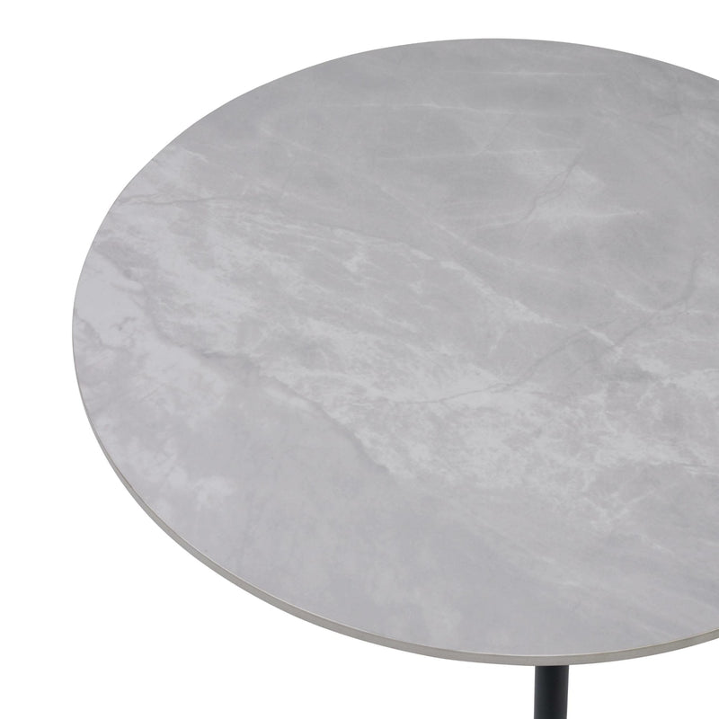 Round marble table with a light gray surface on a white background