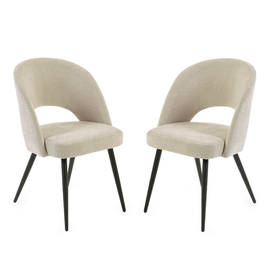 Two beige upholstered chairs with black legs on a white background
