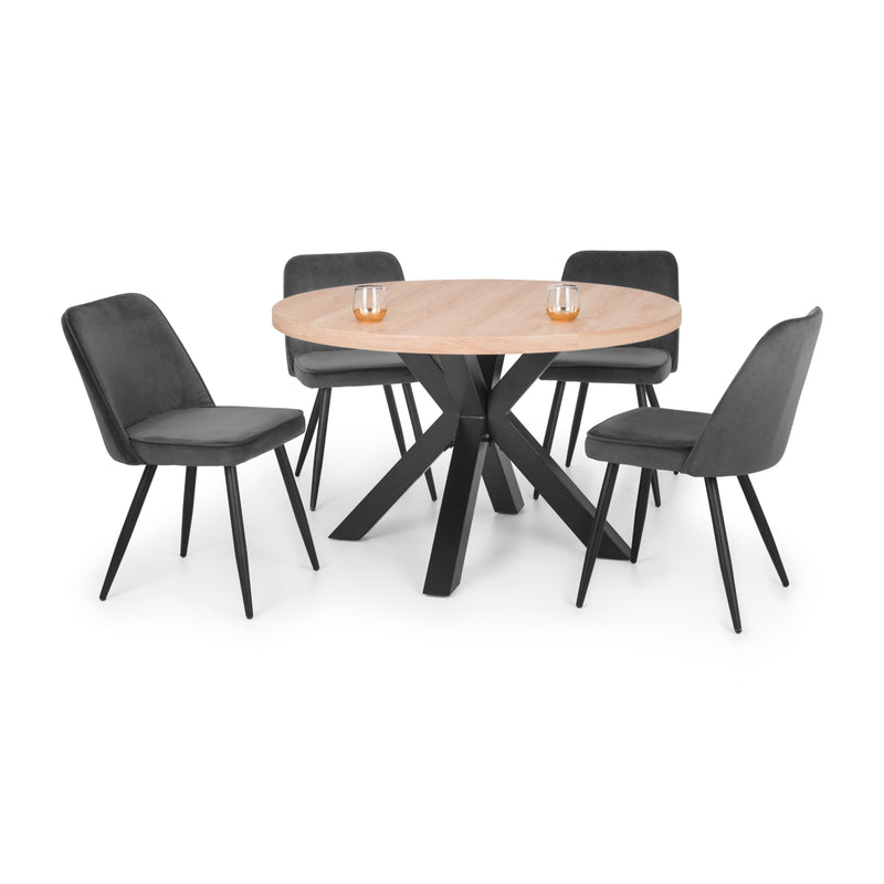 Dining set with round table and four black chairs on a white background