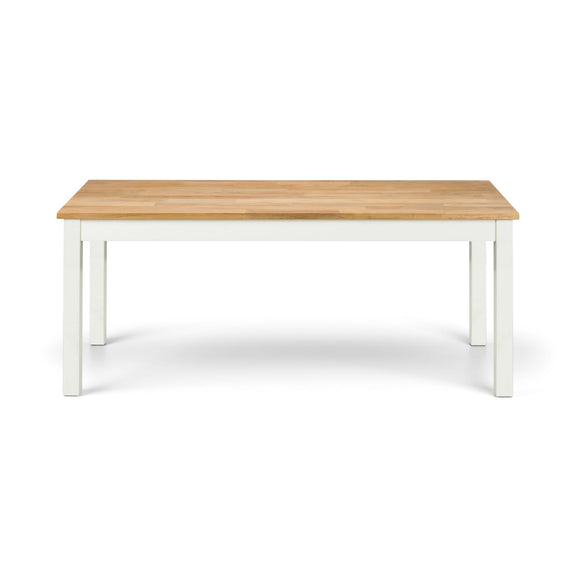 Wooden table with white legs on a white background