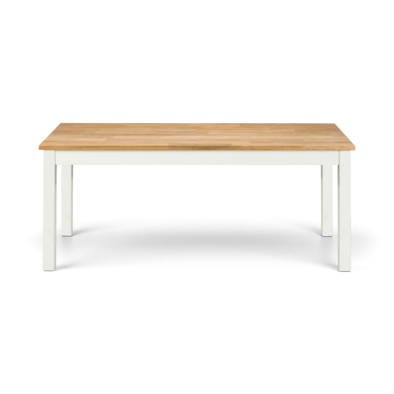 Wooden table with white legs on a white background