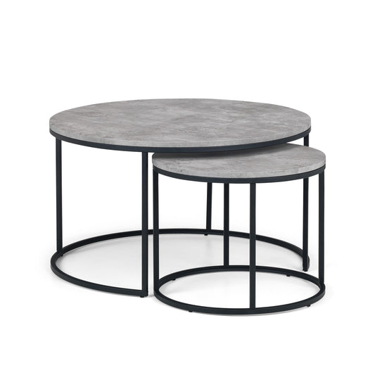 Set of two round coffee tables with gray marble tops and black metal frames on a white background