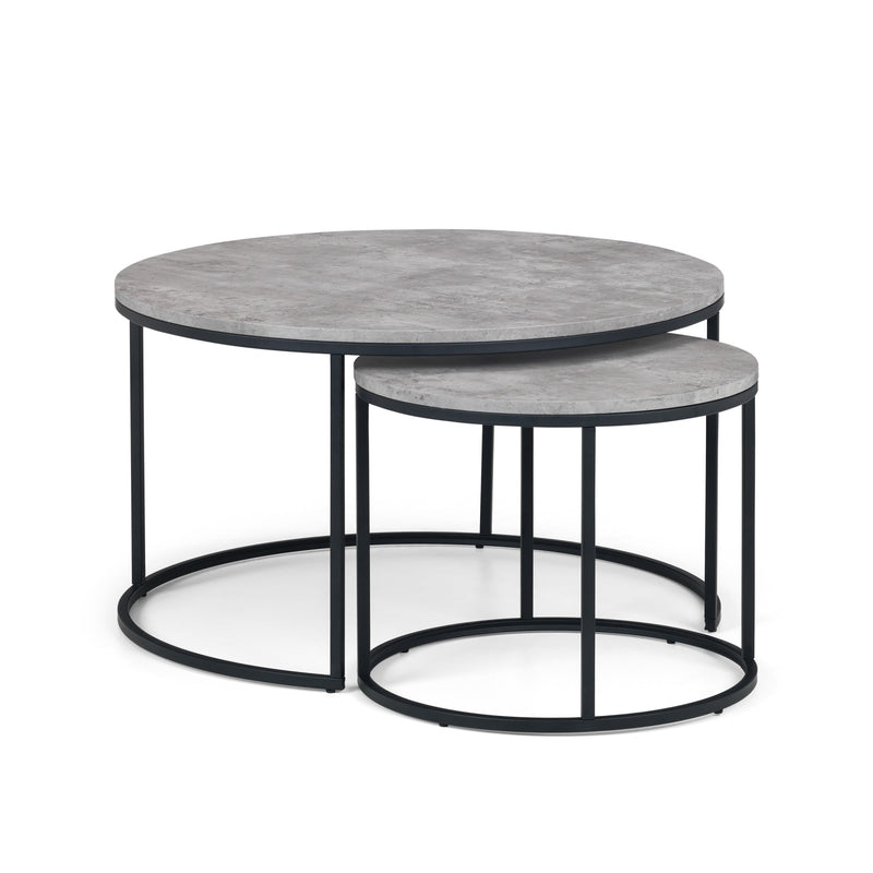 Set of two round coffee tables with gray marble tops and black metal frames on a white background