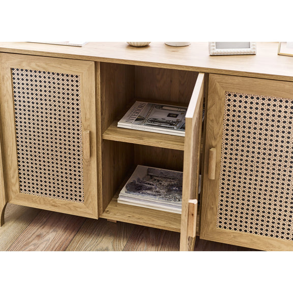 Wooden sideboard with rattan doors and open shelves on a white background