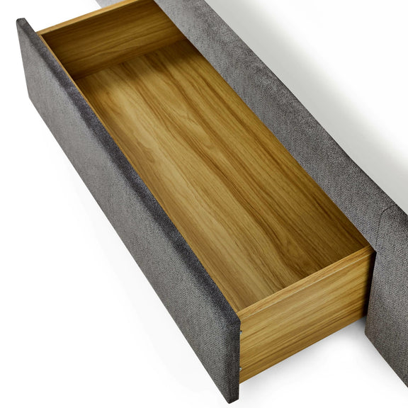 Gray upholstered bench with an open wooden storage compartment on a white background