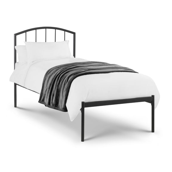 Black metal bed frame with white bedding and gray blanket on a white background