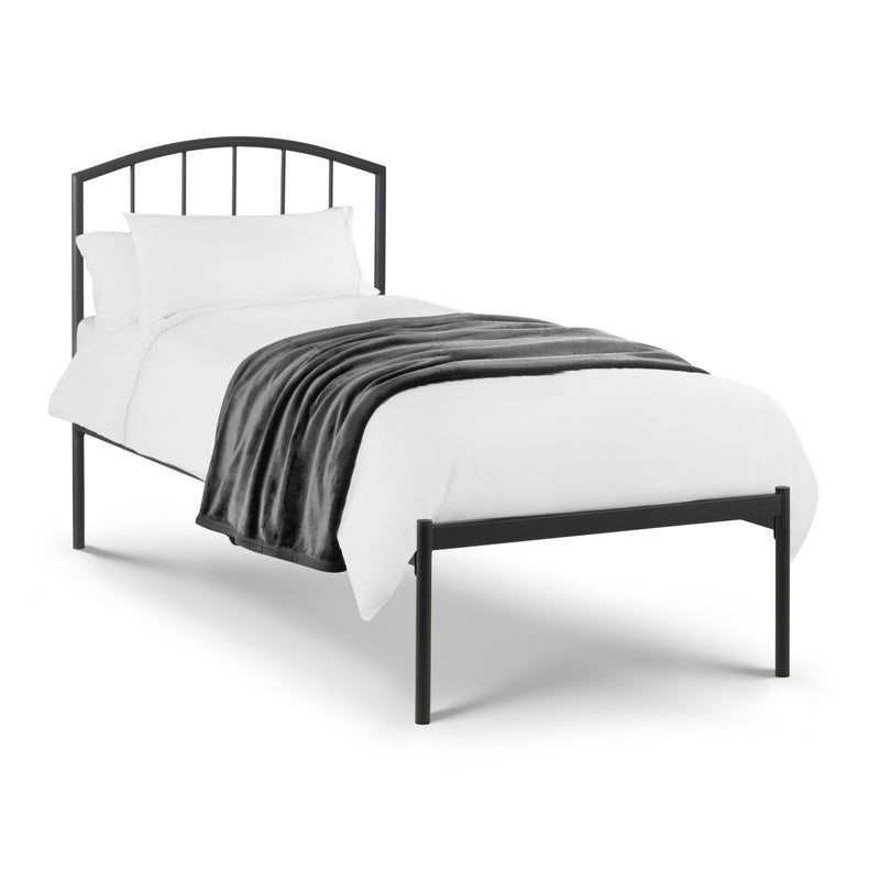 Black metal bed frame with white bedding and gray blanket on a white background