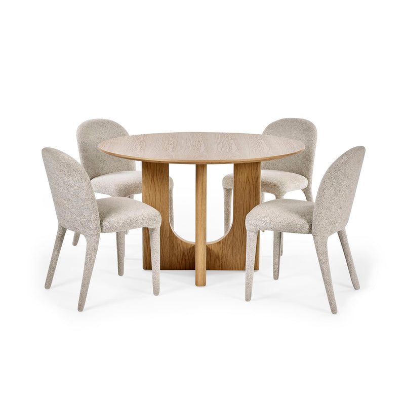 Round wooden dining table with four matching chairs on a white background