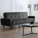 Gray sofa in a modern living room with a coffee table and lamp.