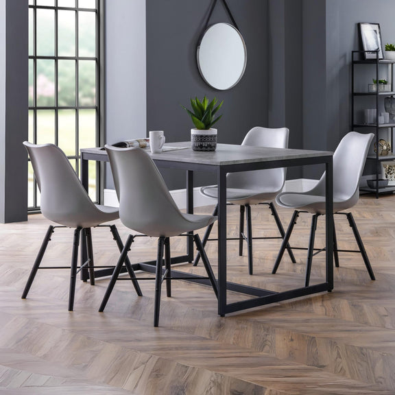 Dining room with a table and chairs in a modern interior setting.