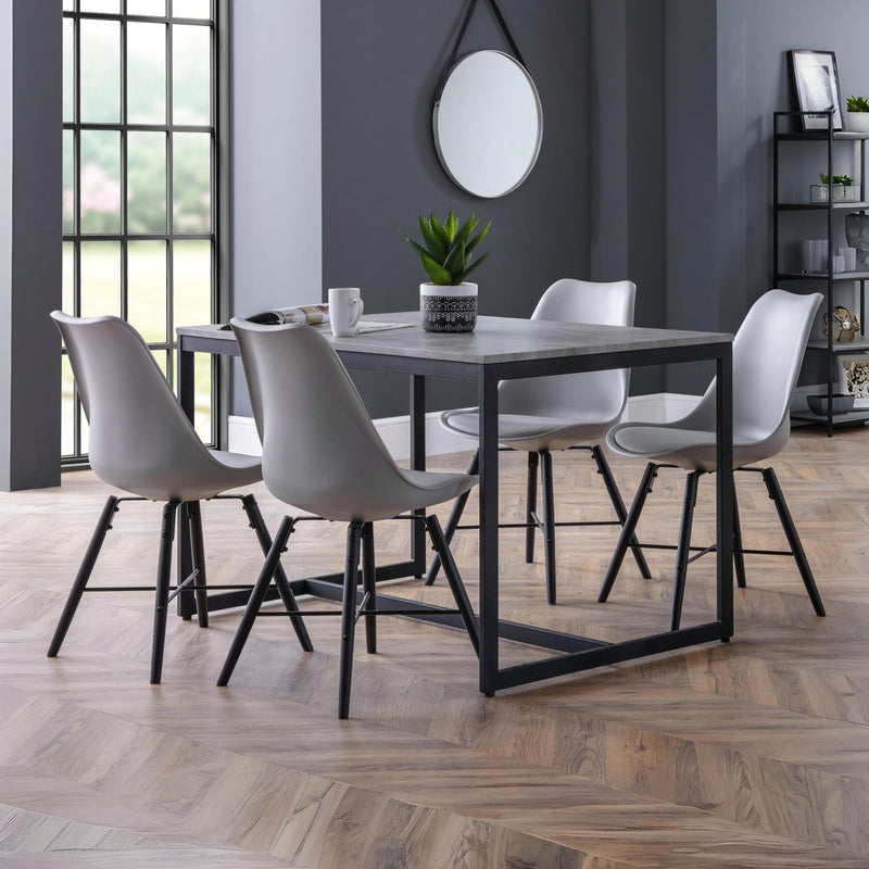 Dining room with a table and chairs in a modern interior setting.