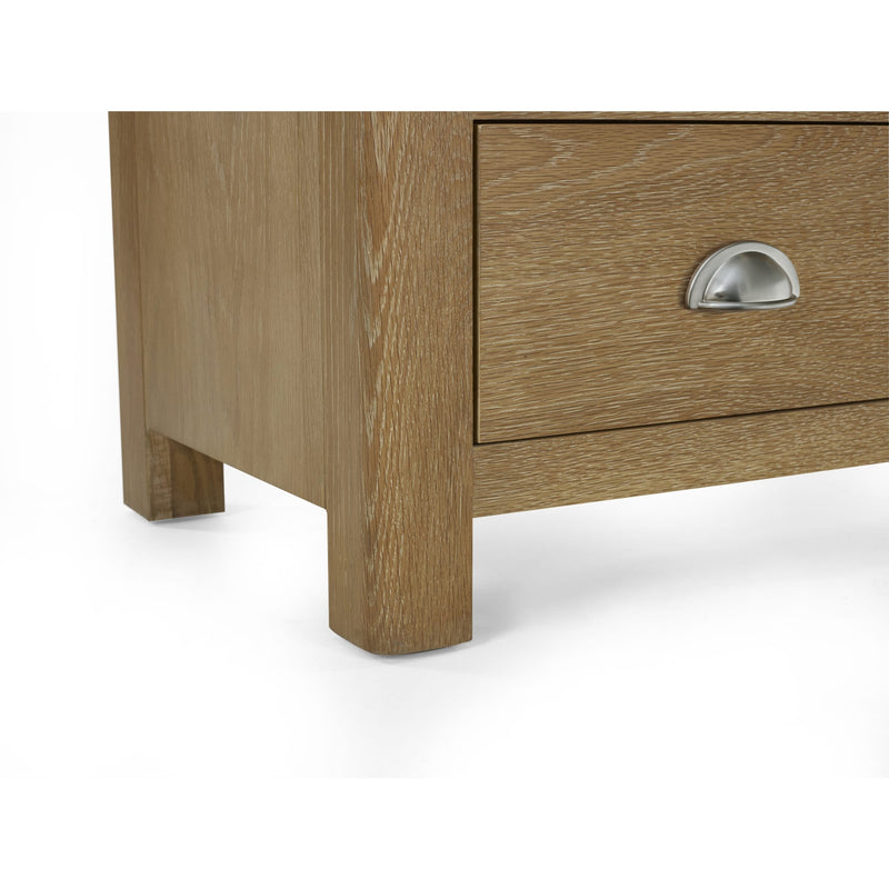 Wooden drawer with metal handle on a white background