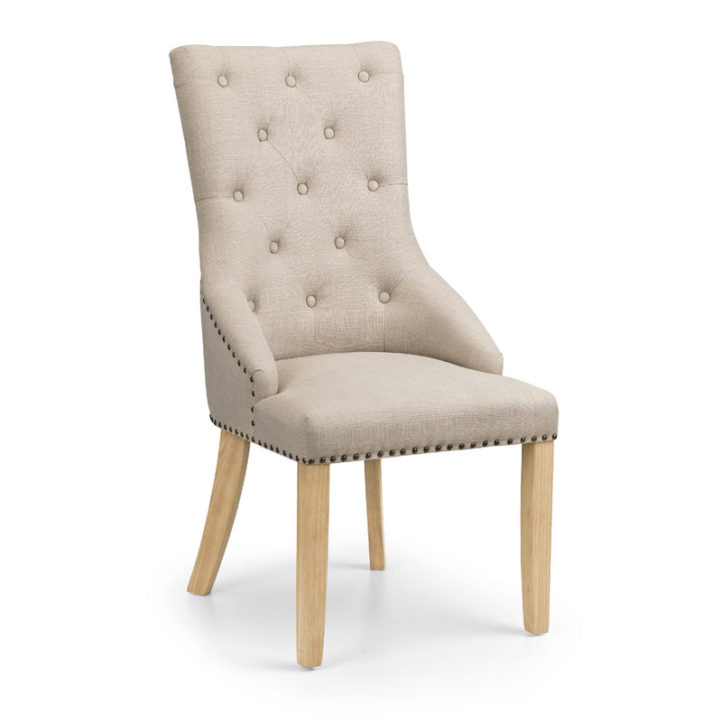 Beige upholstered chair with wooden legs on a white background